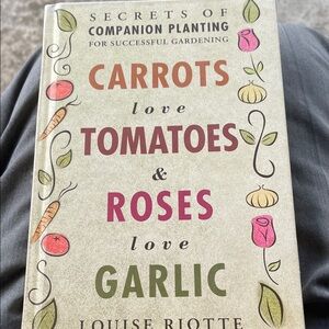 Carrots Love Tomatoes & Roses Love Garlic Decorative Garden Book- Hardback